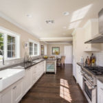 traditional-galley-kitchen-with-white-cabinets-backsplash